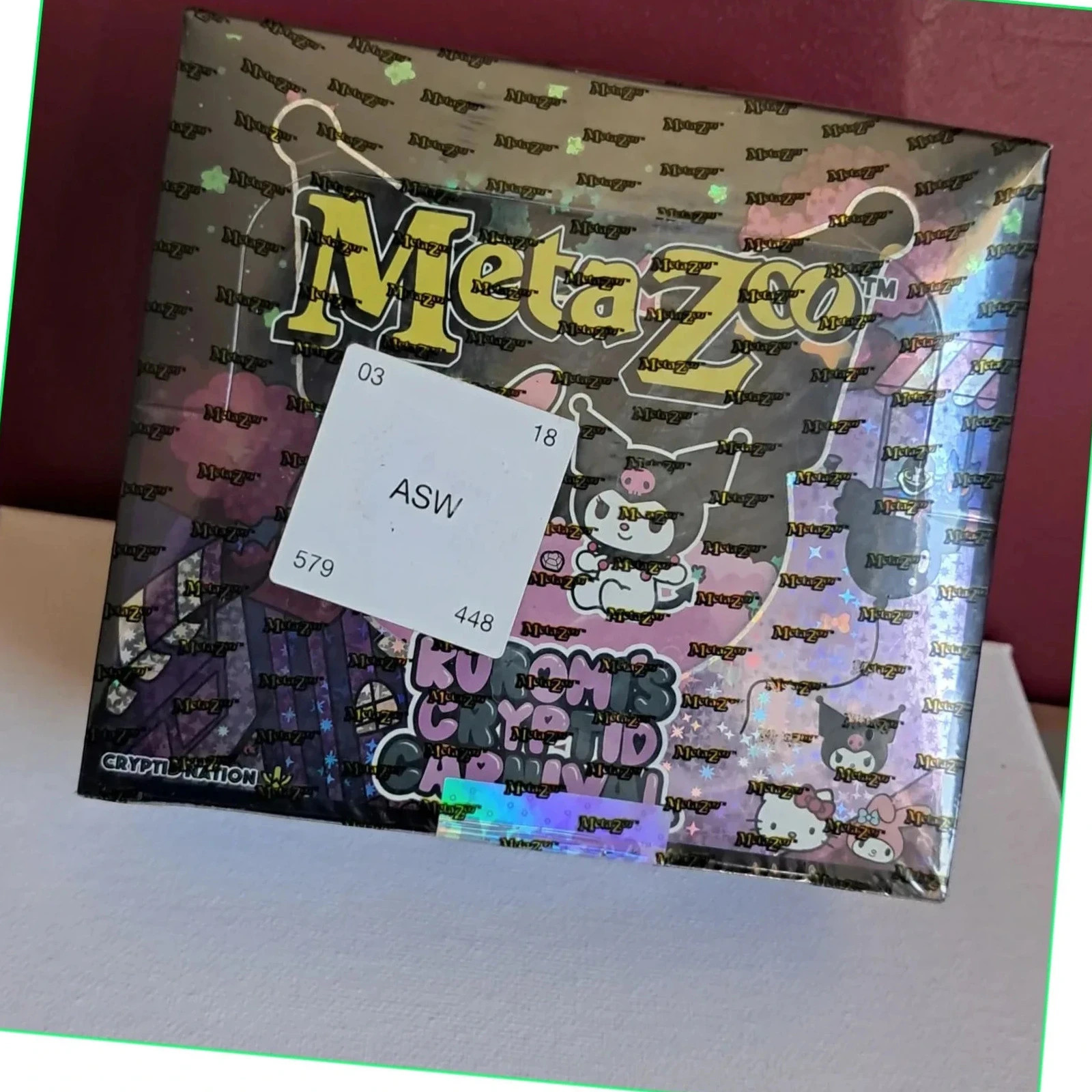Booster Box MetaZoo TCG – Kuromi's Cryptid Carnival sous blister (scellé et neuf)