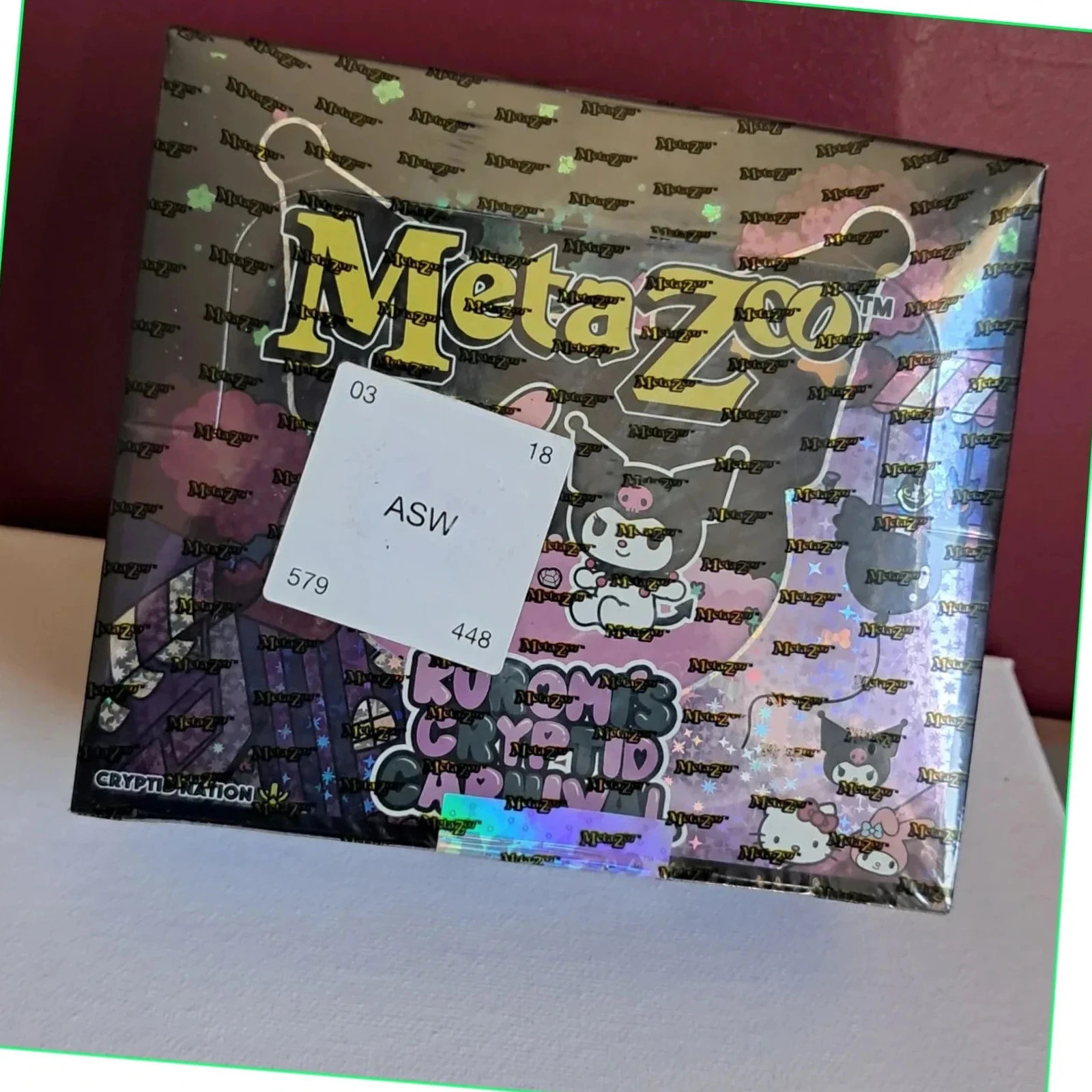 Booster Box MetaZoo TCG – Kuromi's Cryptid Carnival scellée sous blister (neuf)